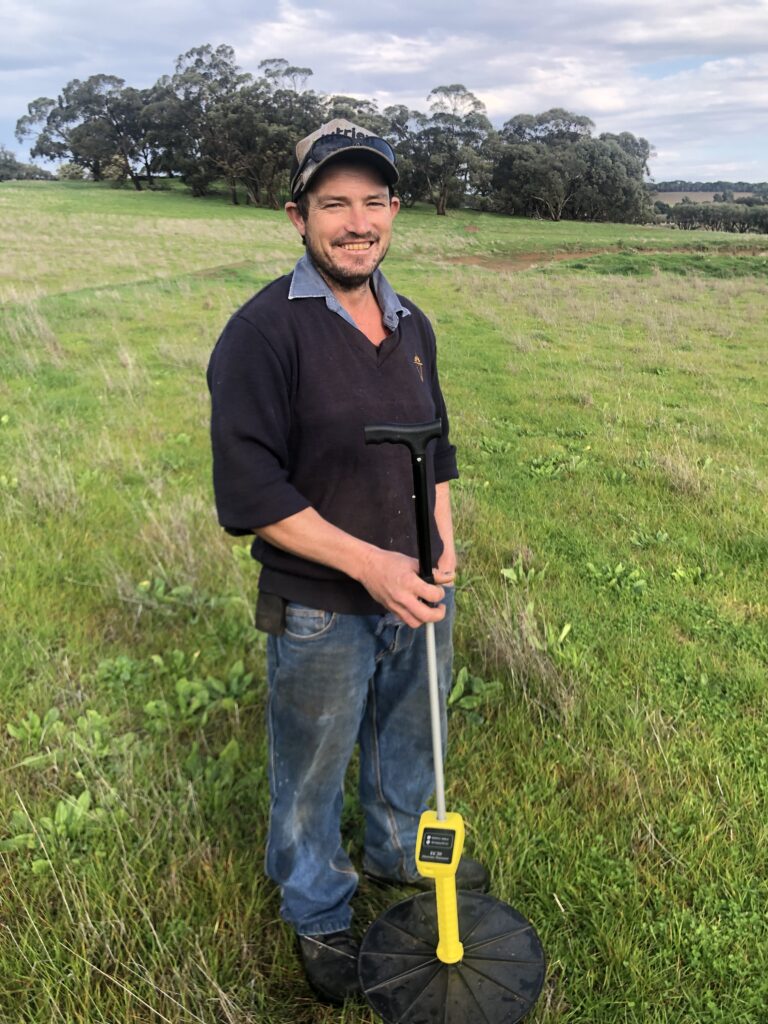 Matt Neldner with the plate meter 
used to assess pasture production 